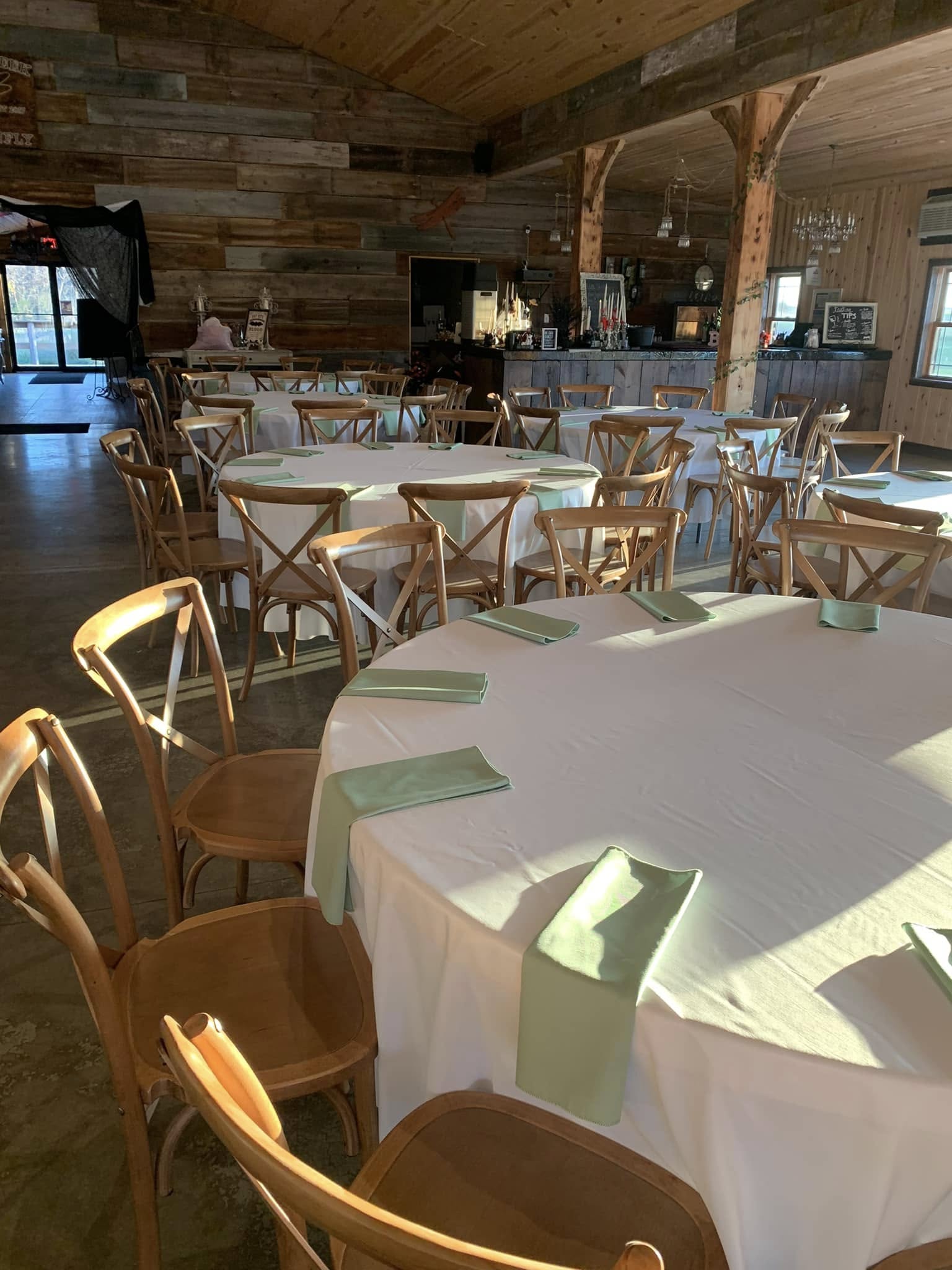 minimal sage green and wood themed wedding reception